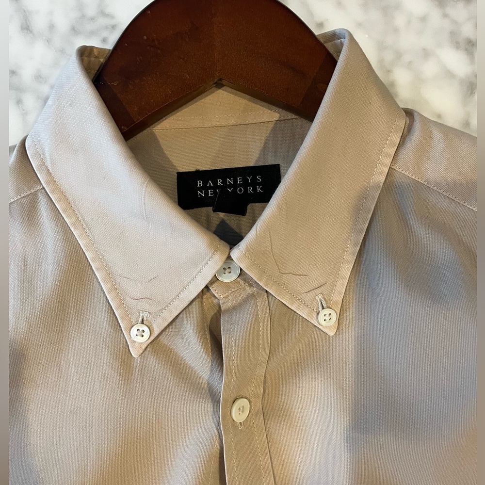 Barney’s beige button down shirt